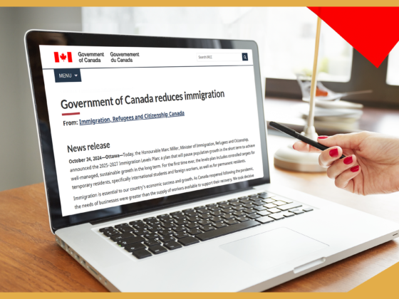 Image shows a laptop with the screen open to the government of Canada website, with a news release about the recent changes to immigration.