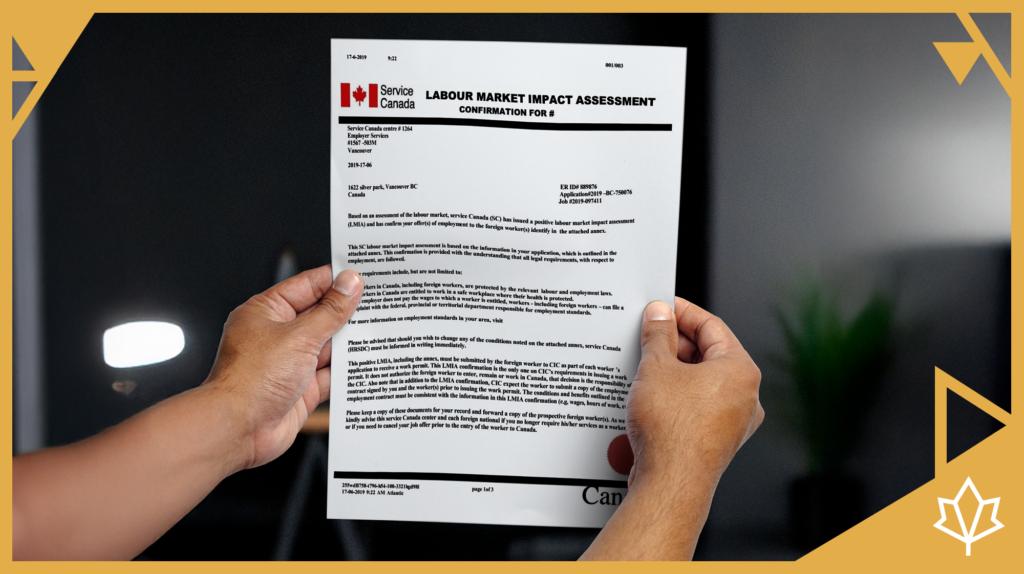 Person holding a Labour Market Impact Assessment (LMIA) confirmation letter issued by Service Canada, with clear text and logos, set against a dark indoor background.